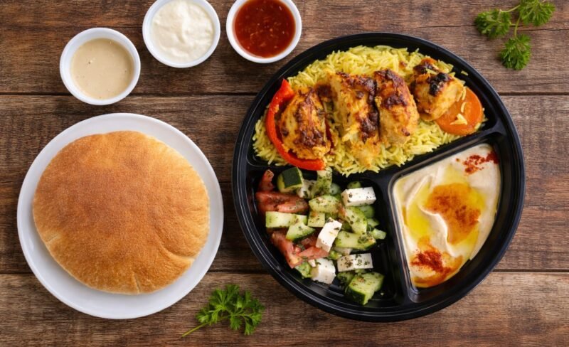 Chicken Kabob Plate Chicken kabob plate with rice, salad, hummus and pita bread